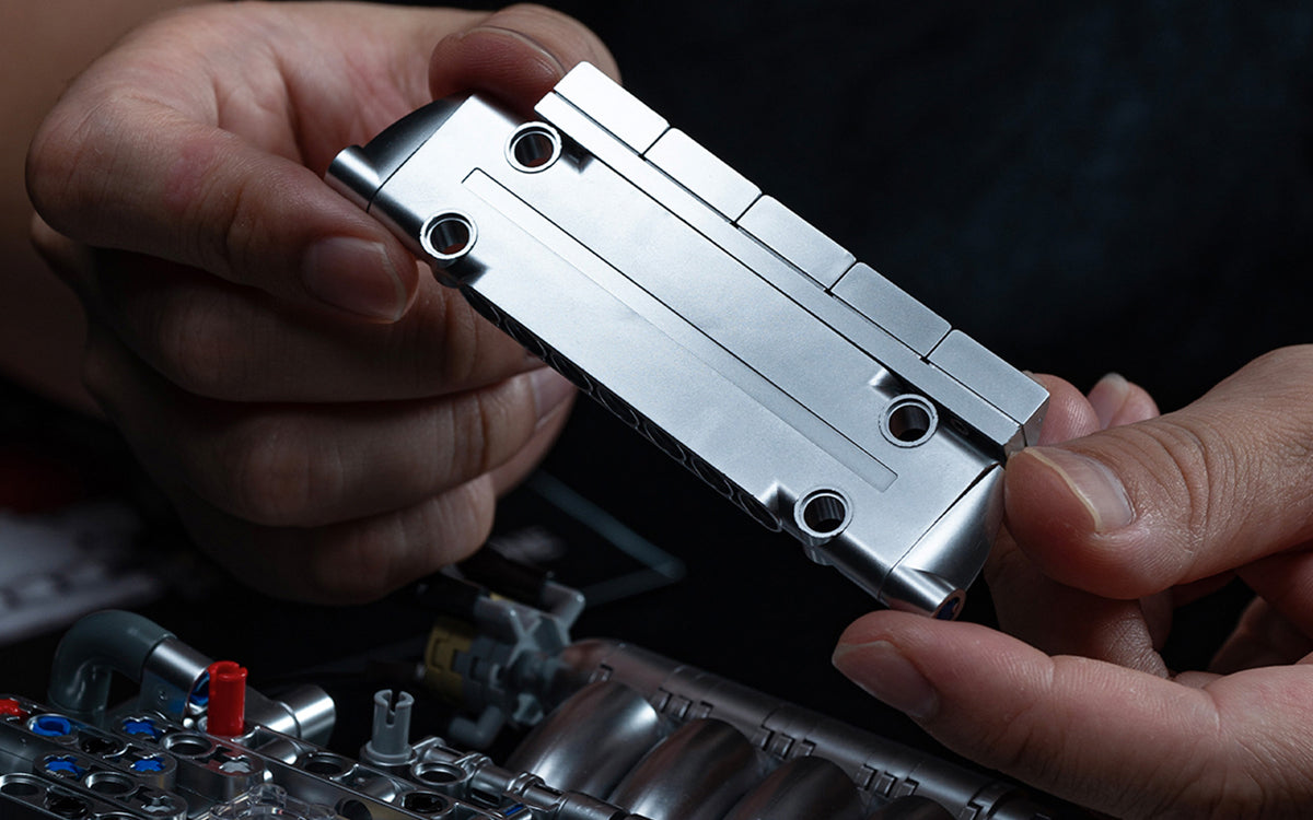 Turn the belt. Watch the mechanism respond.